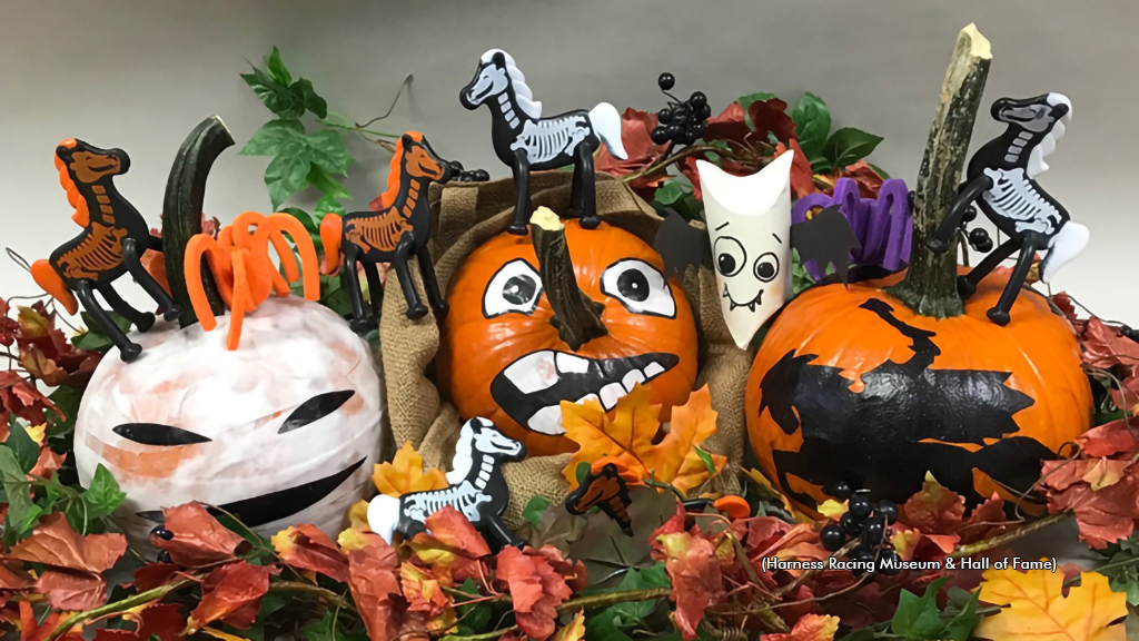 Decorated pumpkins and skelaton horses