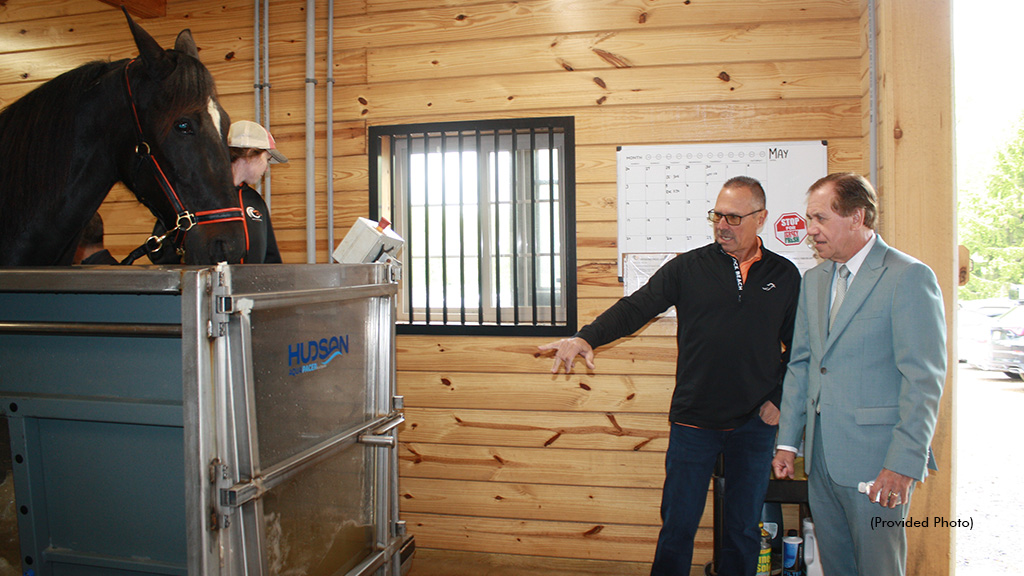 Andy Miller explains the Hydrotherapy Treadmill to Speaker Coughlin