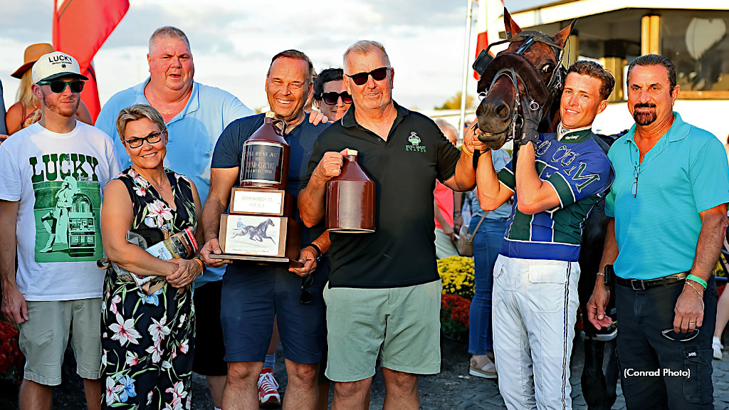 Little Brown Jug champion Captain Albano in the winner's circle