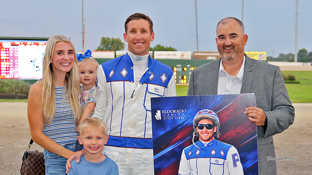Chris Page receives the presentation from Jason Roth