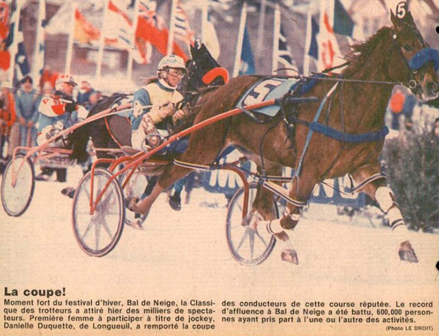 A news clipping of Danielle Duquette driving to victory