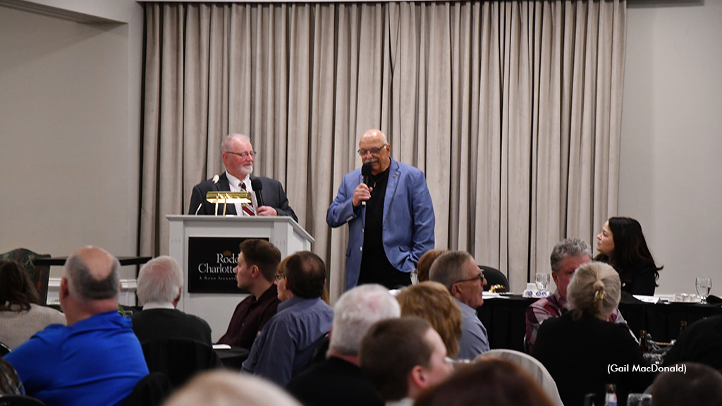 Dr. Ian Moore speaks to a crowd