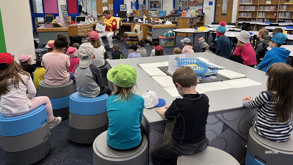 Jeremy Indof reading to kids