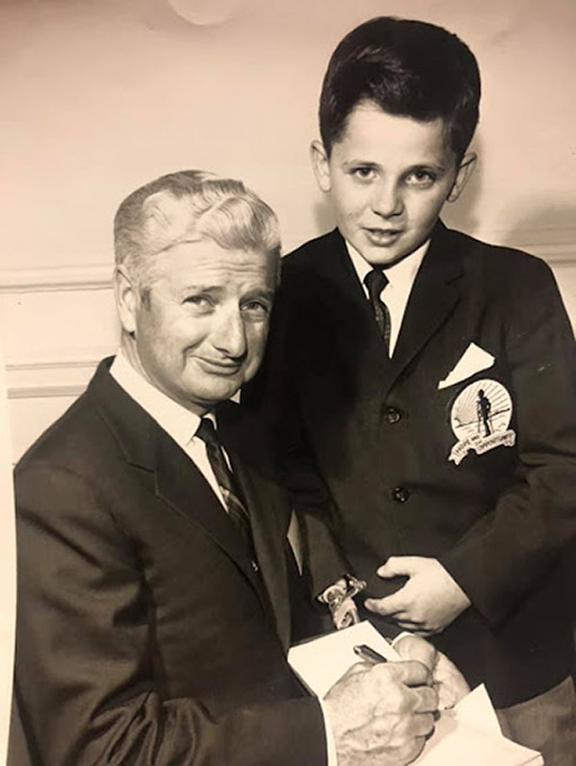 Joe O'Brien signing an autograph for a boy