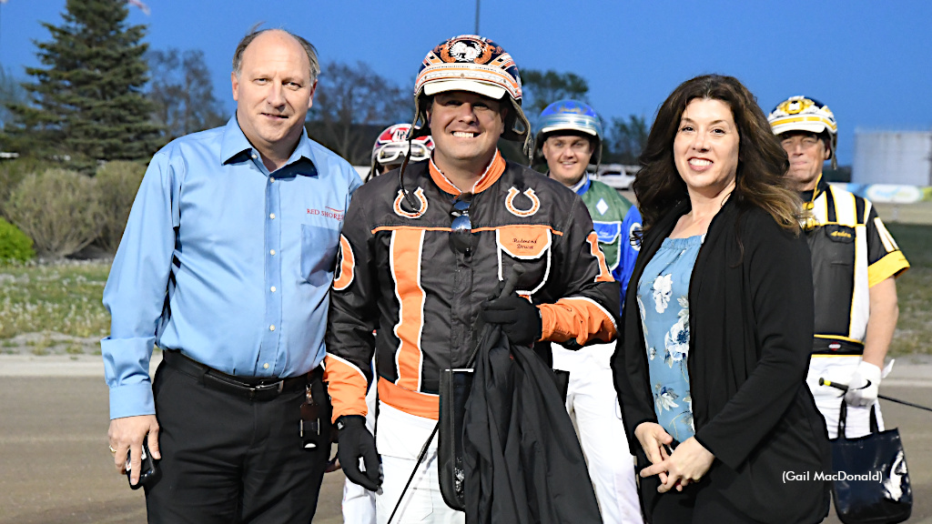 Lee Drake and Andrea Rennsion of Standardbred Canada flank Redmond Doucet (Gail MacDonald photo) 