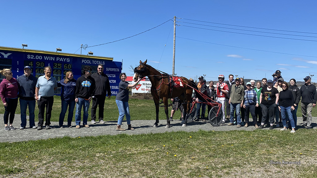 Little Taggs and his connections in the winner's circle at Truro Raceway