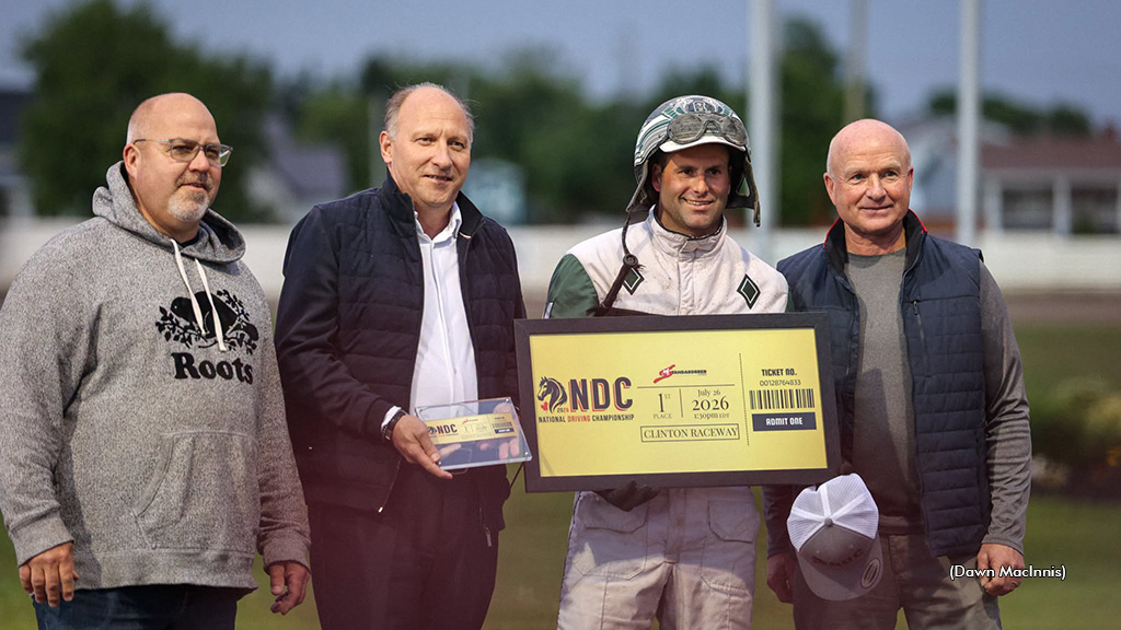 Marc Campbell accepts a framed golden ticket