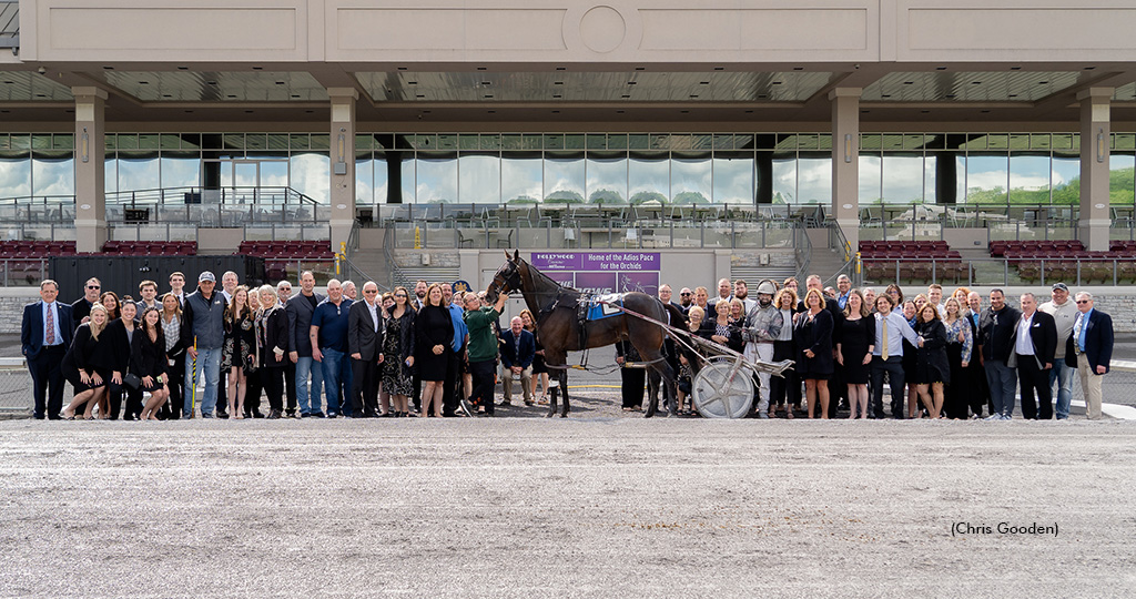 Family and friends of the late Mickey Burke Sr. pay tribute to the horseman in The Meadows winner's circle