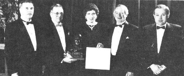 A group of people with an O'Brien trophy