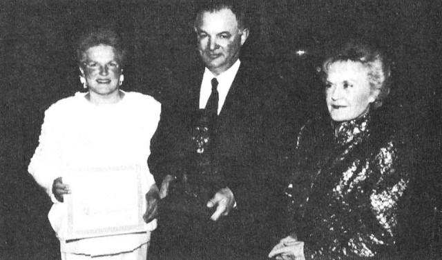 A group of people with an O'Brien trophy
