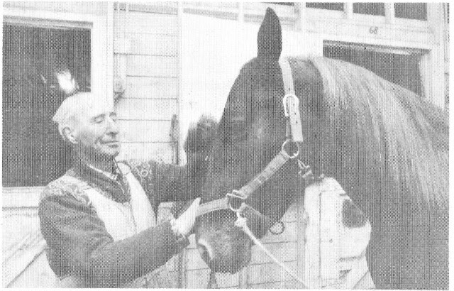 A man petting a horse