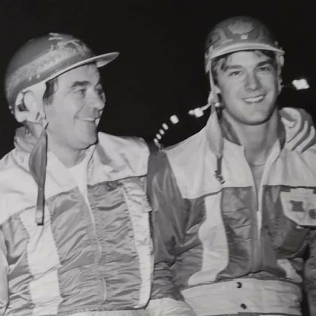 Two men in driving colours