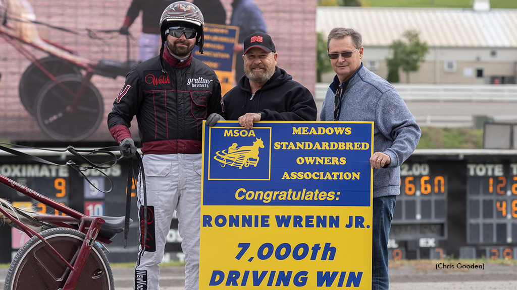 Kim Hankins, MSOA executive director, and Scott Lishia, director of racing for The Meadows, congratulating Ronnie Wrenn, Jr. for his 7,000th career win.