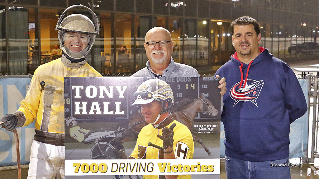 Driver Tony Hall celebrates his 7,000th career win