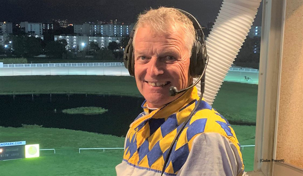 Wally Hennessey in the announcer's booth at Pompano Park