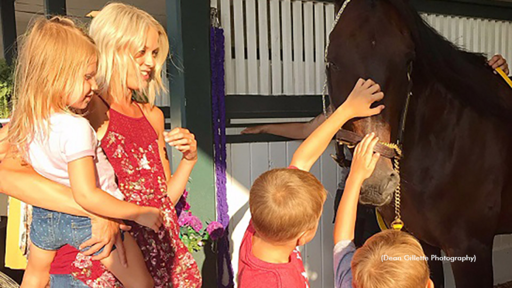 Fan take part in Empire Of Hope meet and greet with retired Standardbred