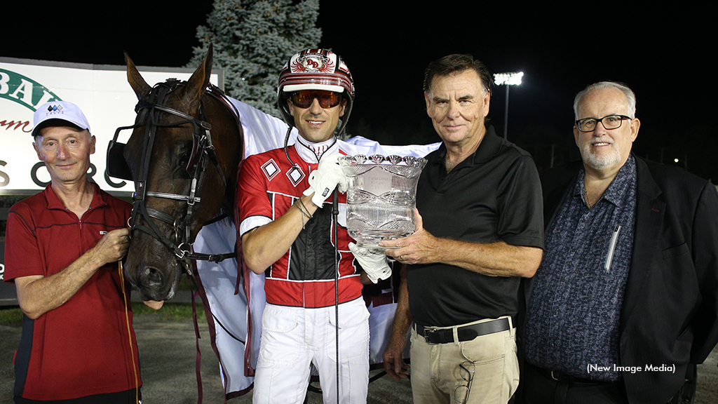 Canadian Pacing Derby champion Bulldog Hanover and his connections in the winner's circle