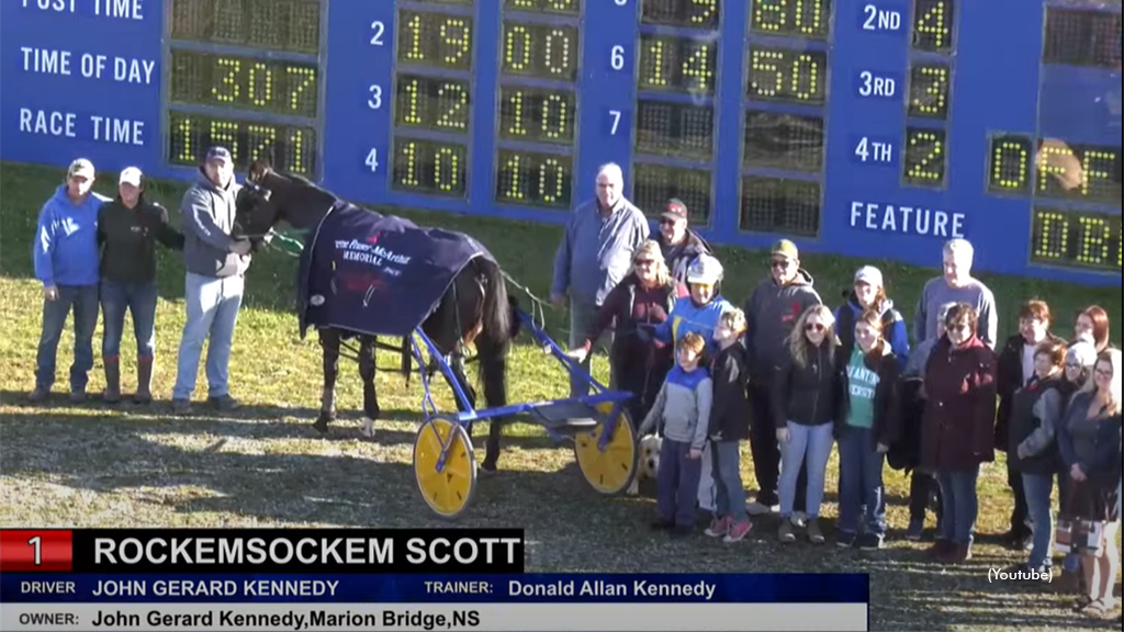 Rockemsockem Scott in the winner's circle at Inverness Raceway