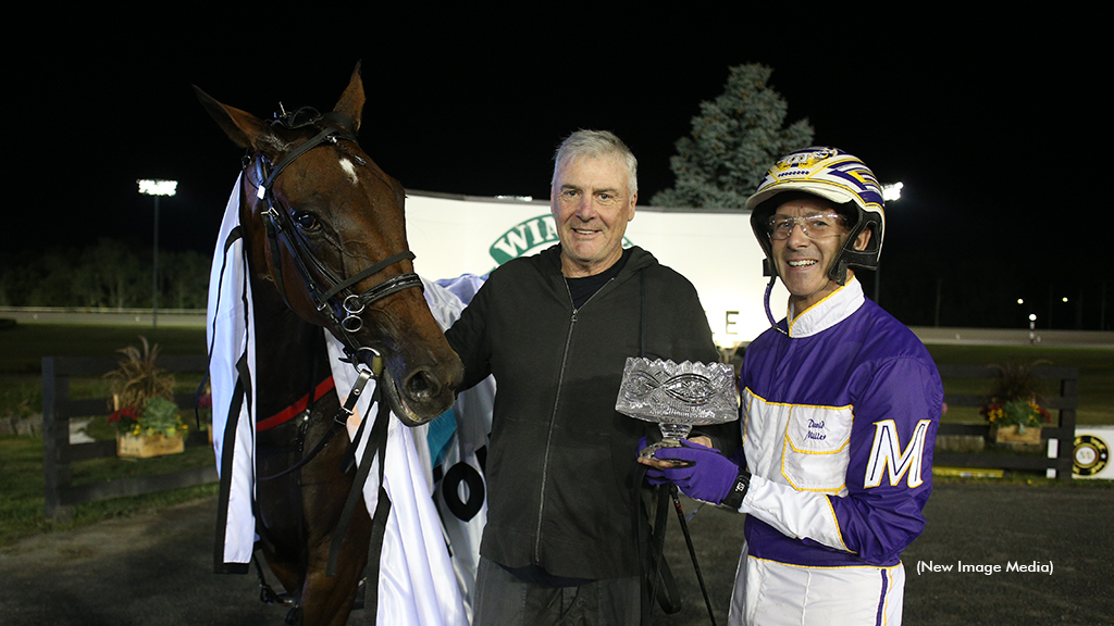 Trainer Brett Pelling with Milton Stakes champion Test Of Faith and driver David Miller