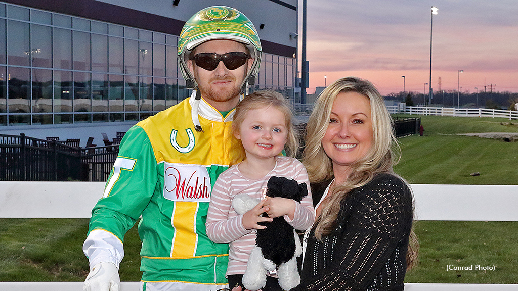 Trace Tetrick celebrates his 7,000th win with his wife Sandy and daughter Chloe