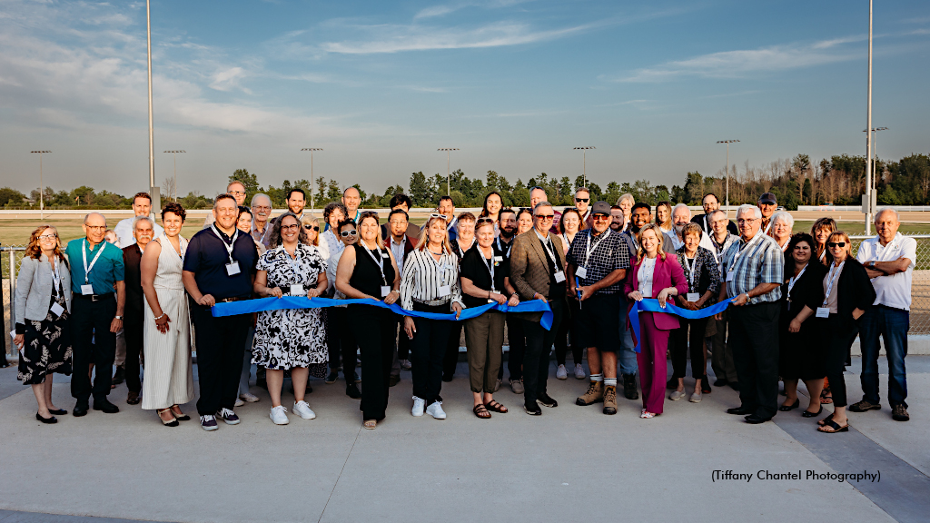 Cutting the ceremonial ribbon for the grand opening of Grand River raceway's new track configuration