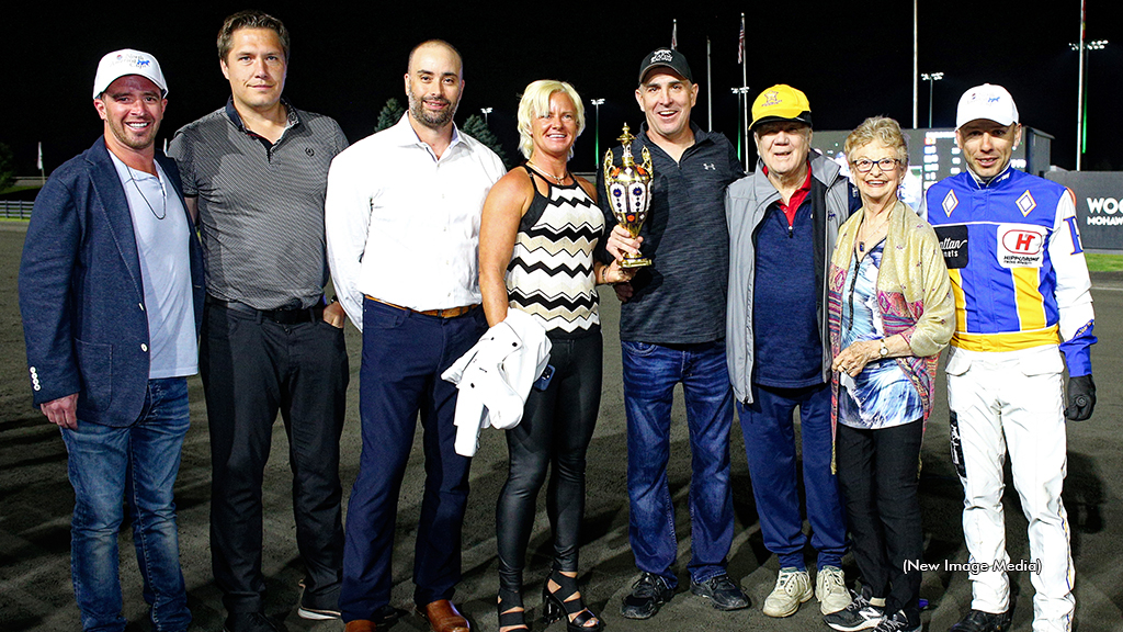 Casie Coleman and Anthony Beaton hold the North America Cup trophy