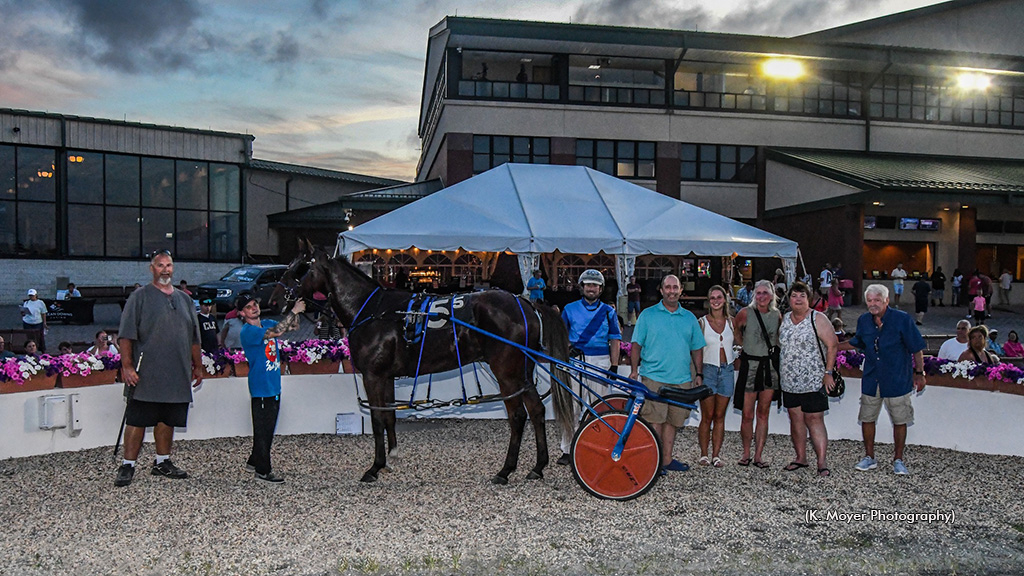 Michael Hall celebrates his 2,000th career win in the Ocean Downs winner's circle