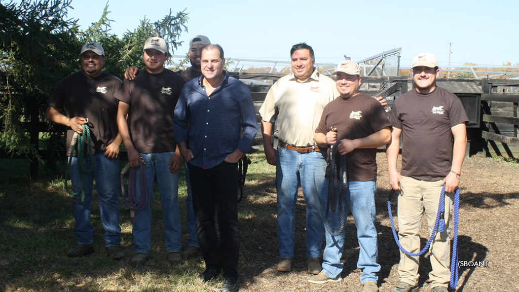 New Jersey Senator Paul Sarlo poses for a photo with the hardworking staff at Fair Winds Farm