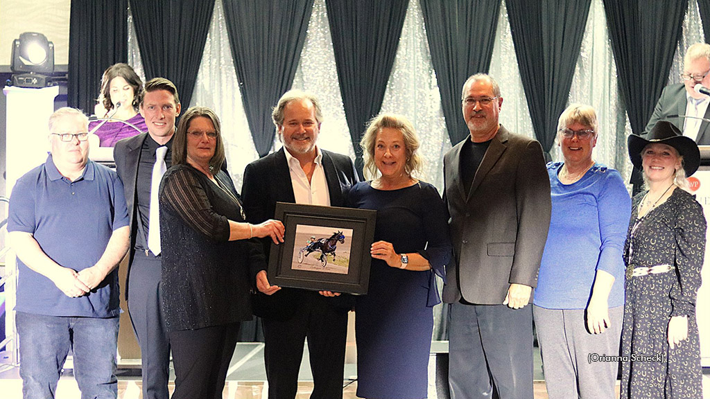 The connections of Outlawguns N Roses, 2024 Alberta Horse of the Year, accepting the ASHA Award