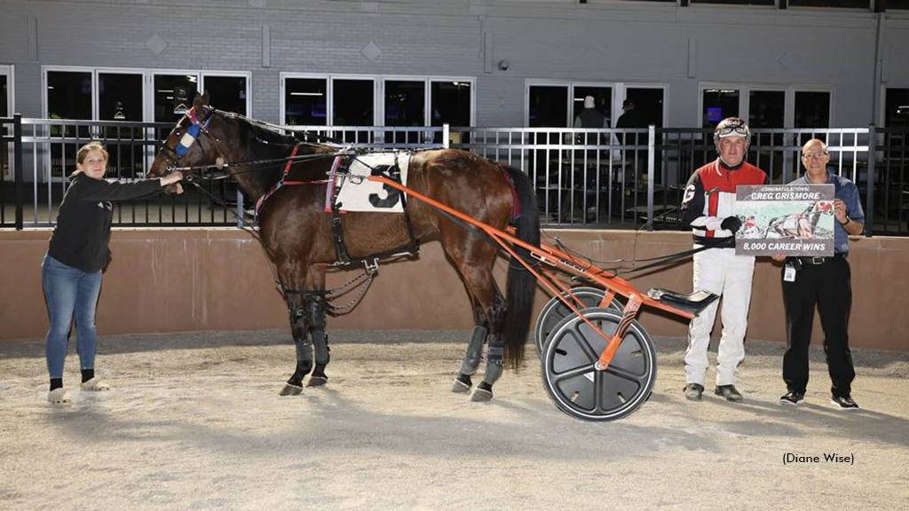 Greg Grismore celebrates his 8,000th career win