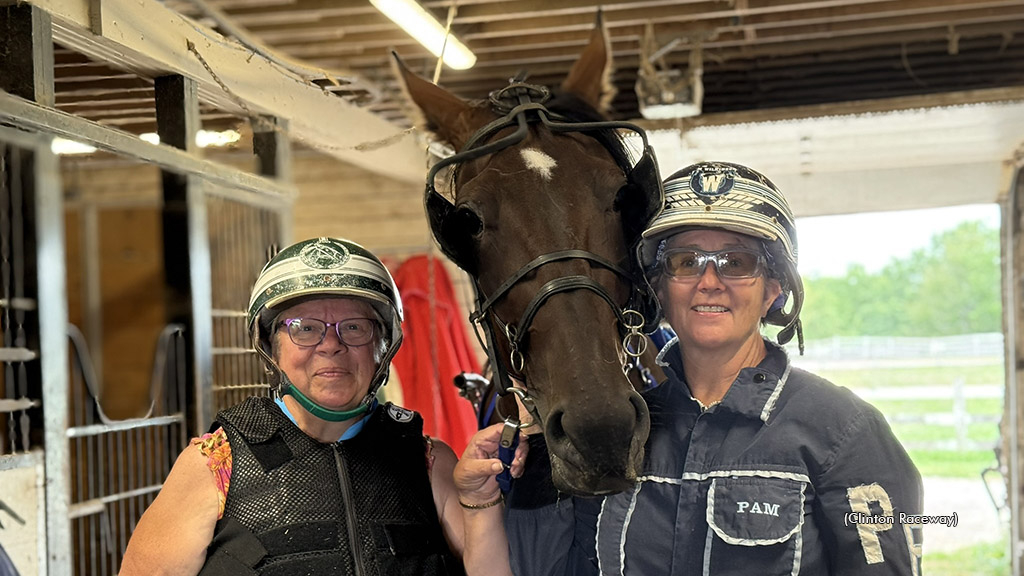 A new racegoer visits Clinton Raceway's paddock