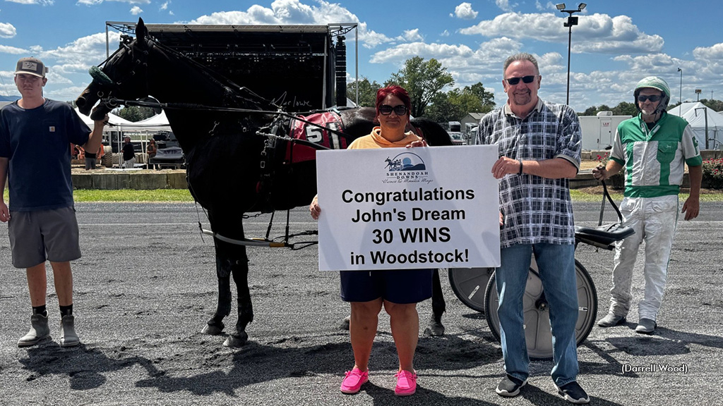 Johns Dream and connections receiving a placard
