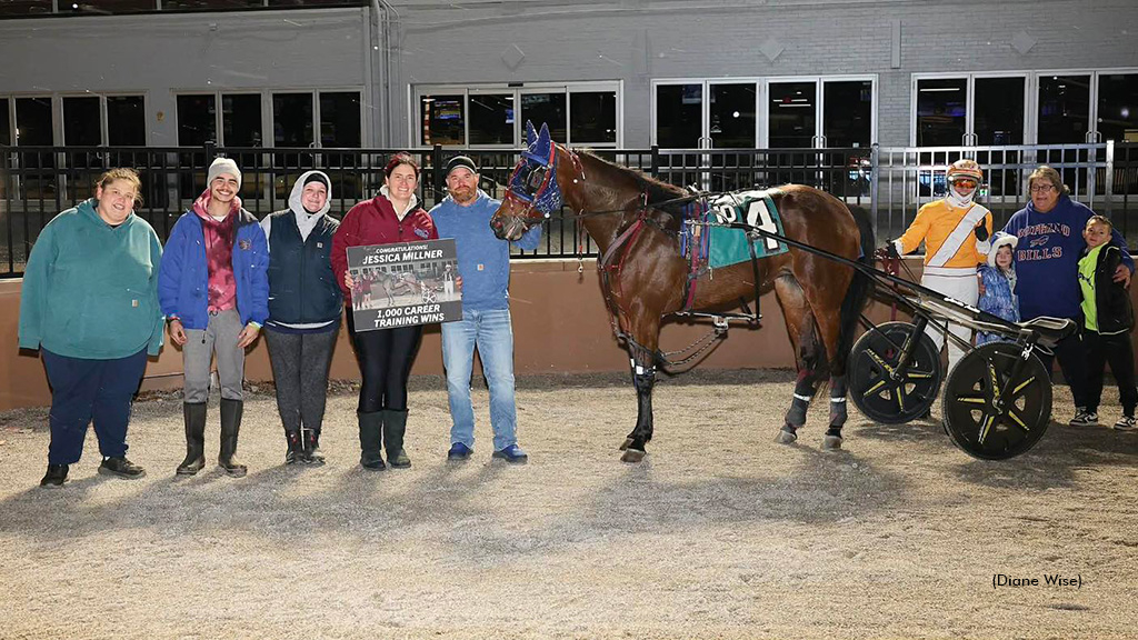 Jessica Millner receiving a presentation for 1,000 wins
