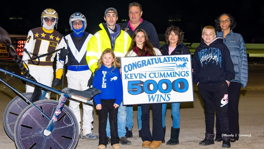 Kevin Cummings receiving a 5,000th win presentation