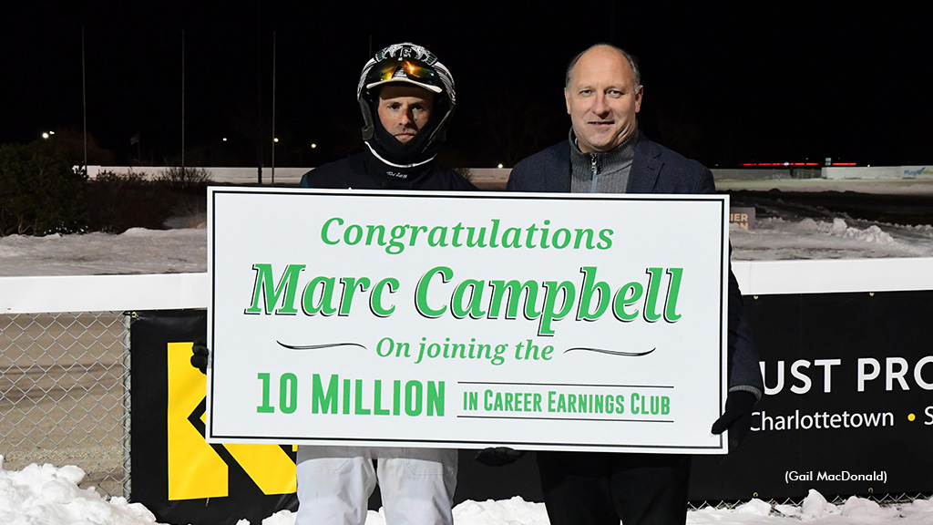 Marc Campbell receiving a placard