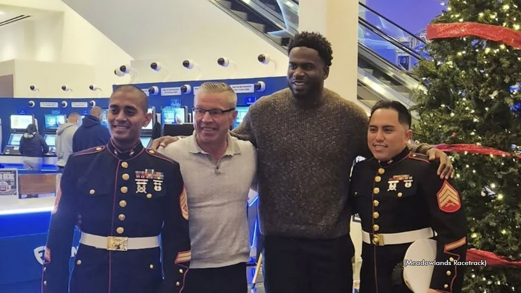 Jason Settlemoir with Quincy Enunwa and United States Marines representatives