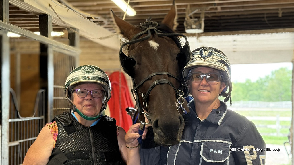 Pam Forgie and a fan pose with a horse