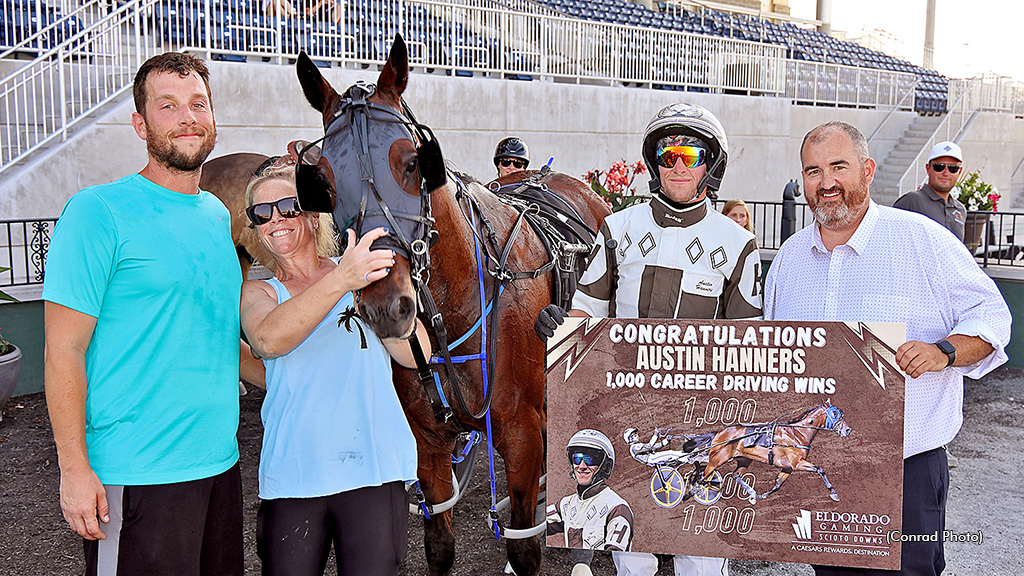 Austin Hanners receiving a placard for his 1,000th win