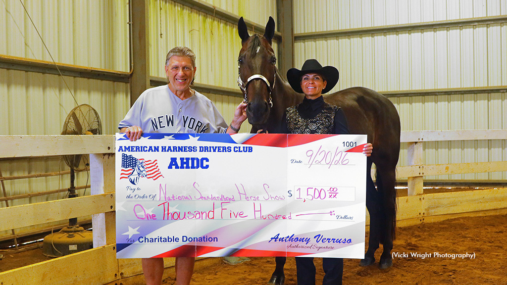 AHDC President Anthony Verruso (left) presenting a donation to Kelly Conn (right) of the SPHO-NJ