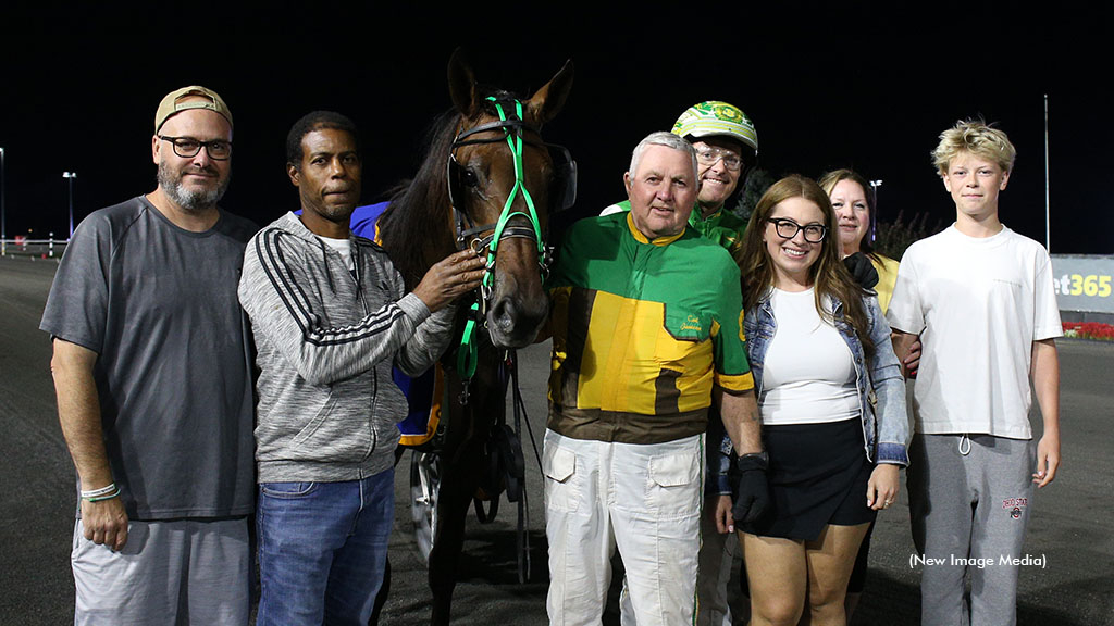 Trainer Carl Jamieson with Ontario Sires Stakes winner Major Contender in the Mohawk winner's circle on Sept. 4, 2026