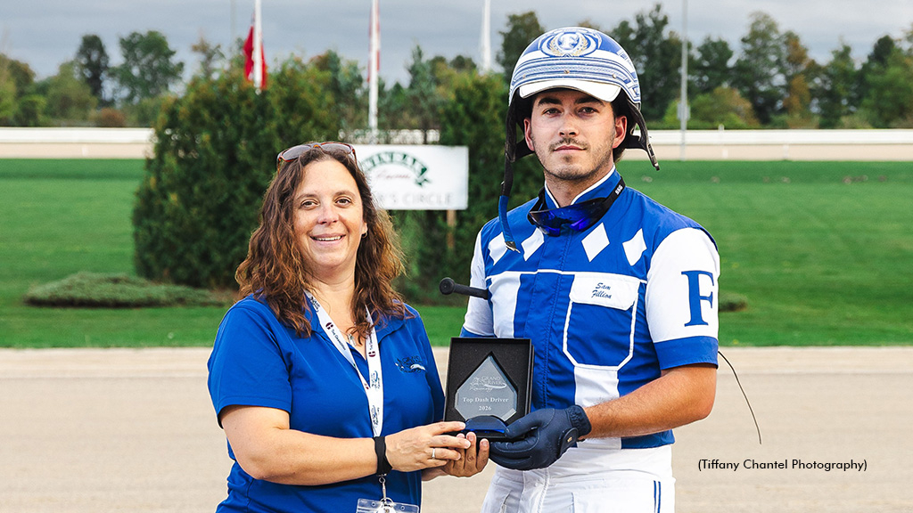 Christine Fairhall presents Samuel Fillion with the award for leading driver
