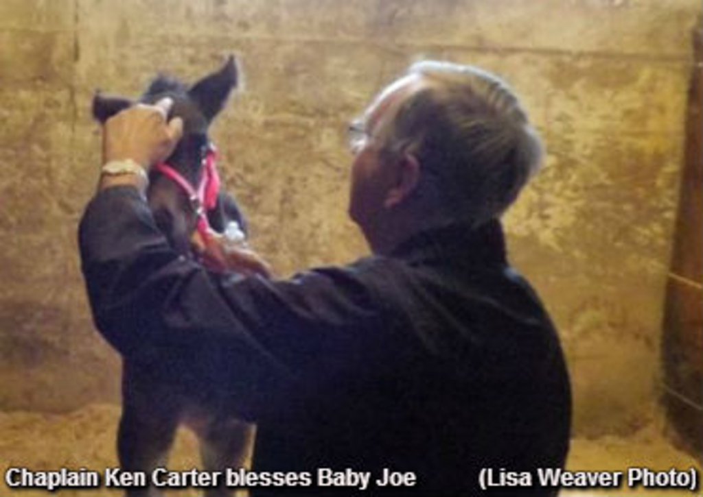 Ken Carter blesses Baby Joegood.jpg