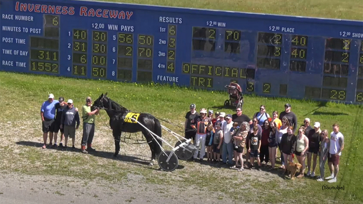 Rotten Ronnie and his connections in the Inverness Raceway winner's circle