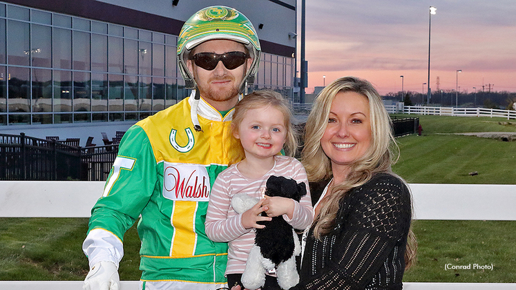Trace Tetrick celebrates his 7,000th win with his wife Sandy and daughter Chloe