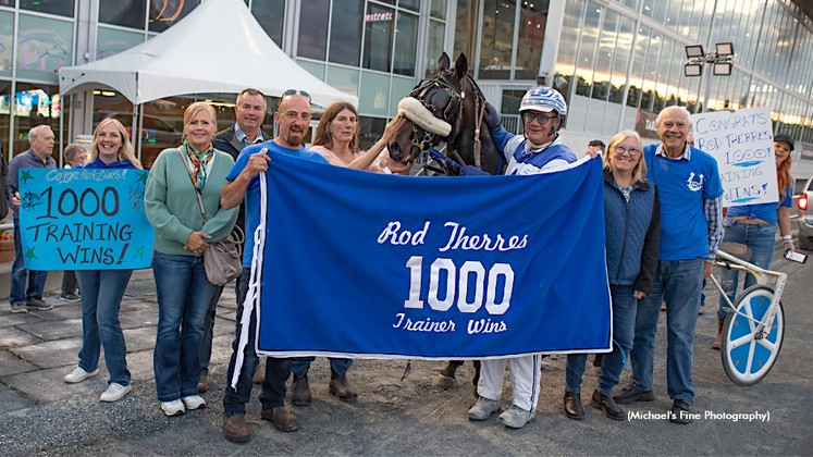 Rod Therres celebrates his 1,000th career training win