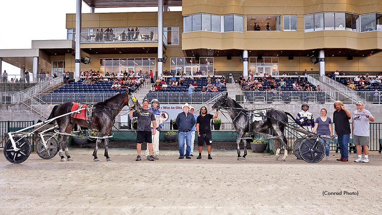 Captain Cowboy and Celtic Spirit N in the Scioto Downs winner's circle