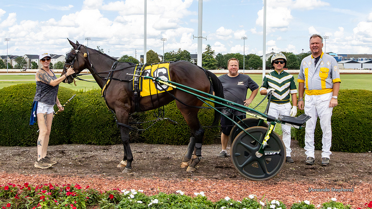 Ron Burke and Kimpanzee in the winner's circle