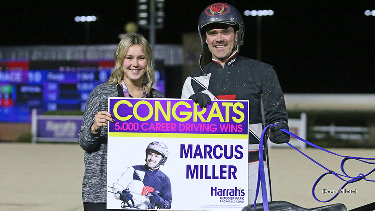 Marcus Miller receiving a presentation for his 5,000th win