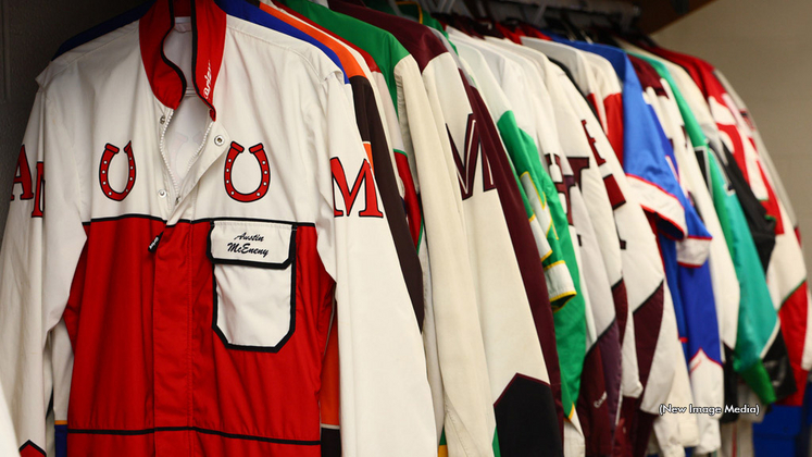 Driving suits hanging up in the Woodbine Mohawk Park drivers room