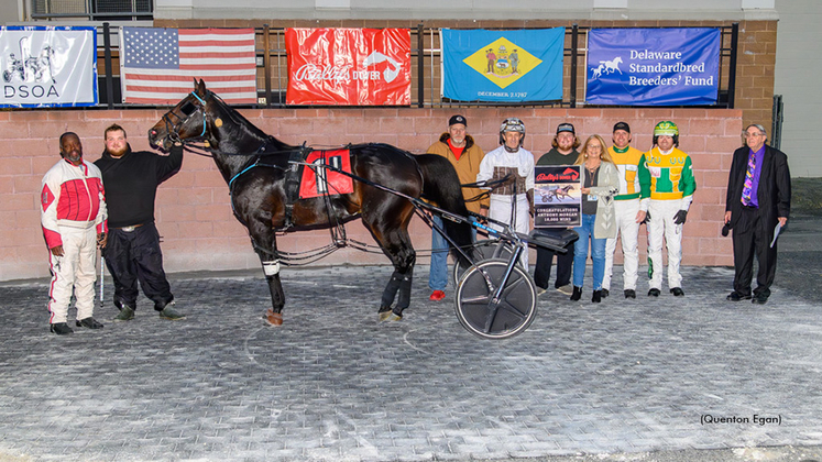 Tony Morgan receiving a presentation for reaching 18,000 wins